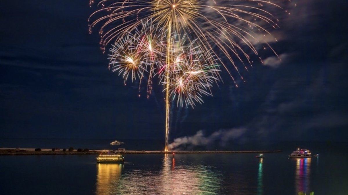 Fireworks on a beach at night.