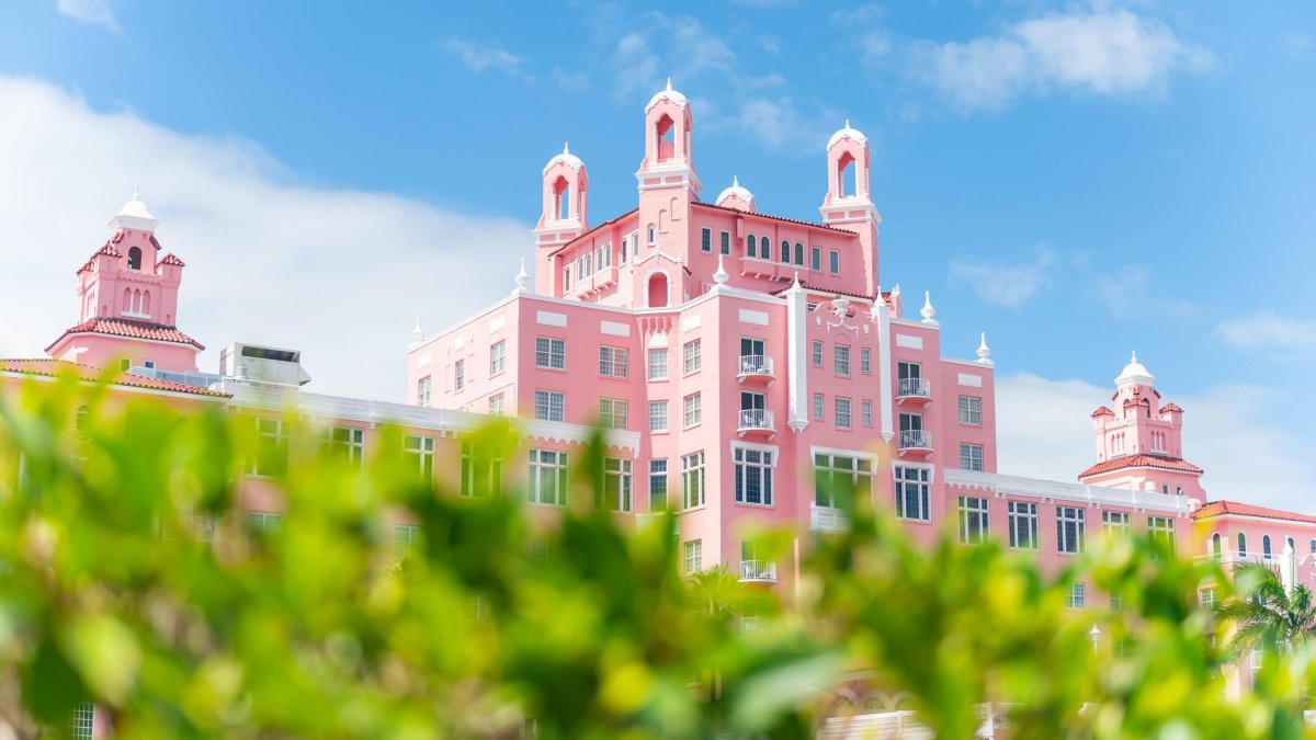 The Don CeSar Hotel with green bushes in the foreground