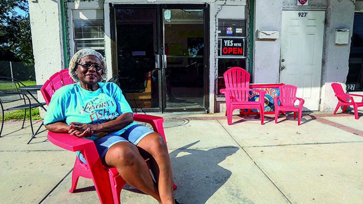 Lorene Office sits outside Lorene's Fish House