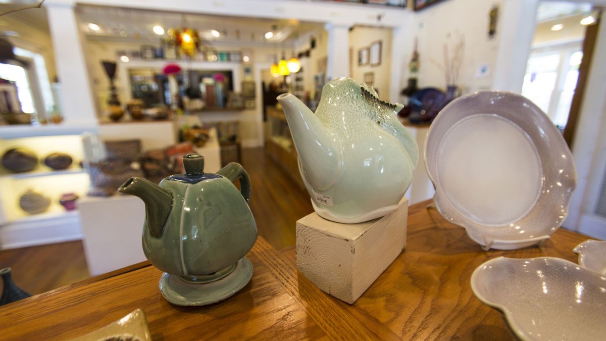 A set of 3 handmade pots at a craft store