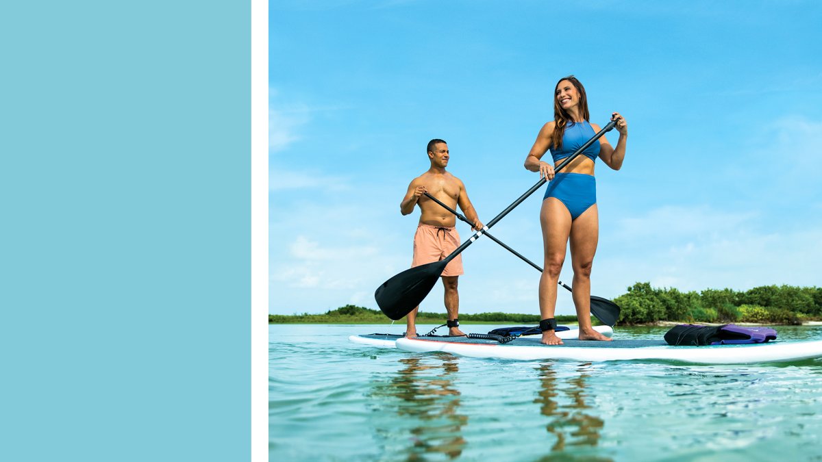 a light blue box next to a couple paddleboarding