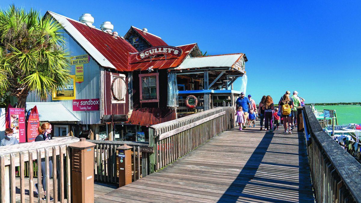 Wooden boardwalk in John's Pass Village and seafood restaurant