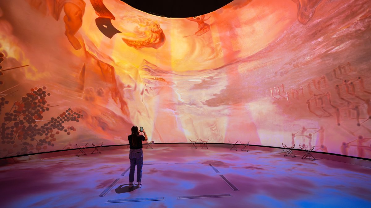 Dome projection with woman in front of it