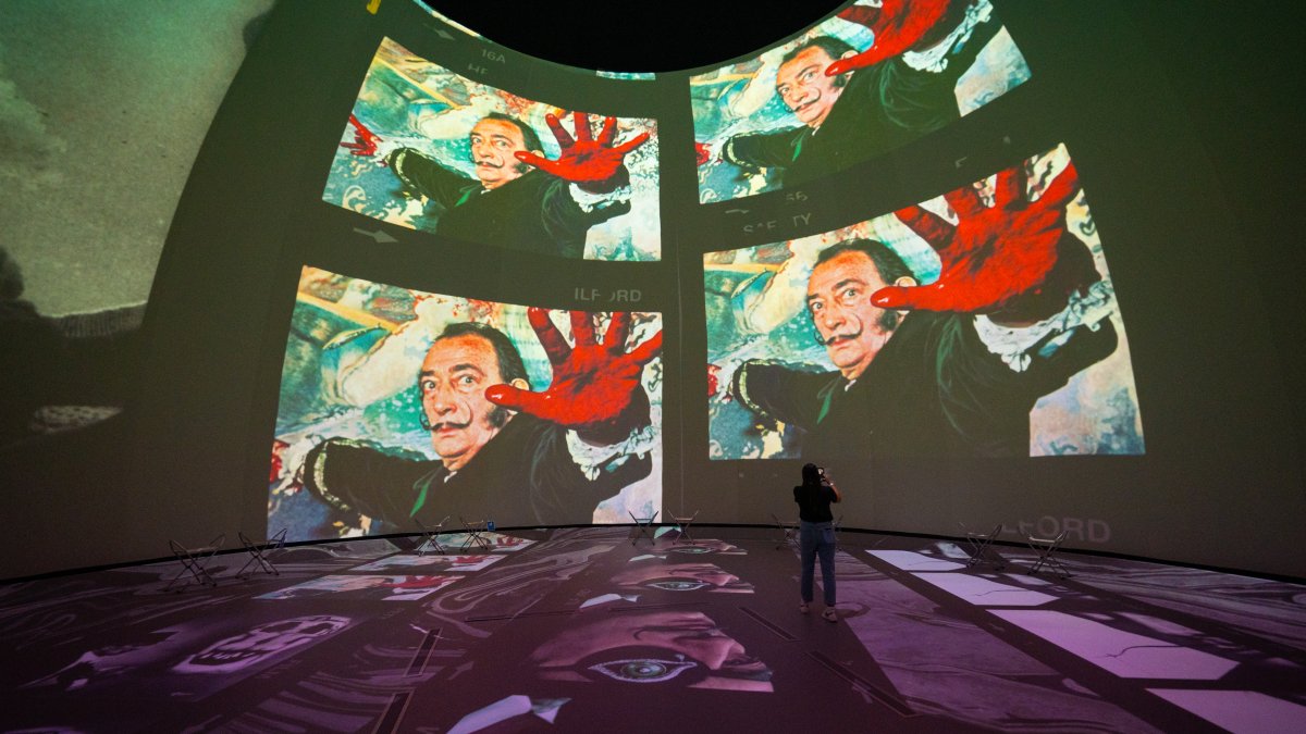 Dome projection with woman in front of it 