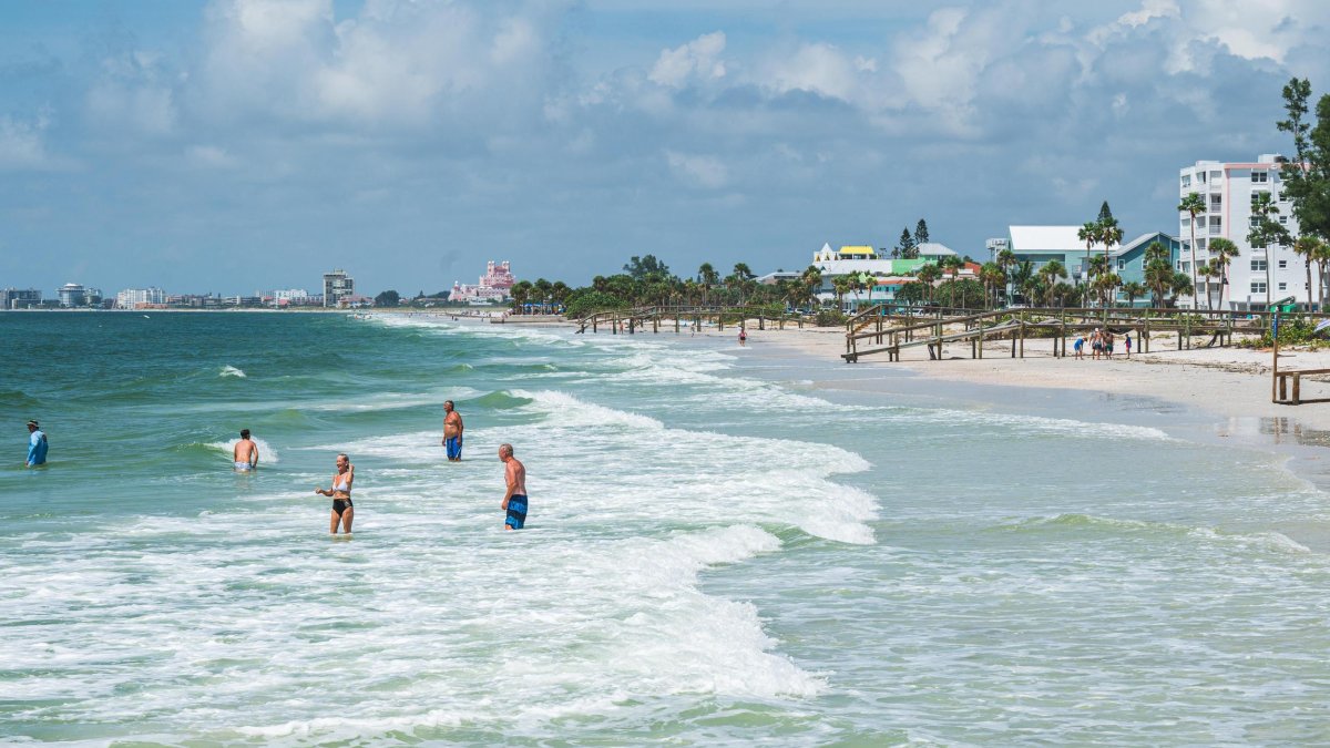 swimmers in gentle surf at Pass-a-Grille Beach