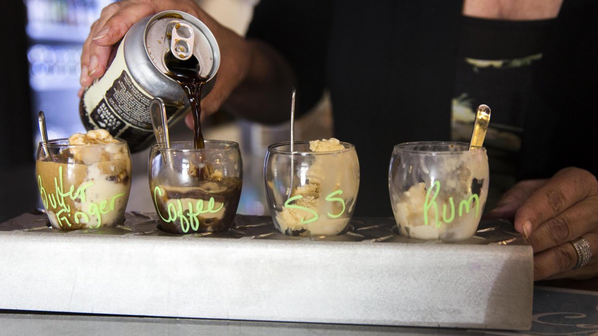 a woman pours a dark beer over a flight of gelato in 4 flavors