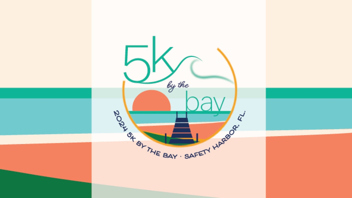 5K by the Bay racing event poster featuring a blue background and the ocean.