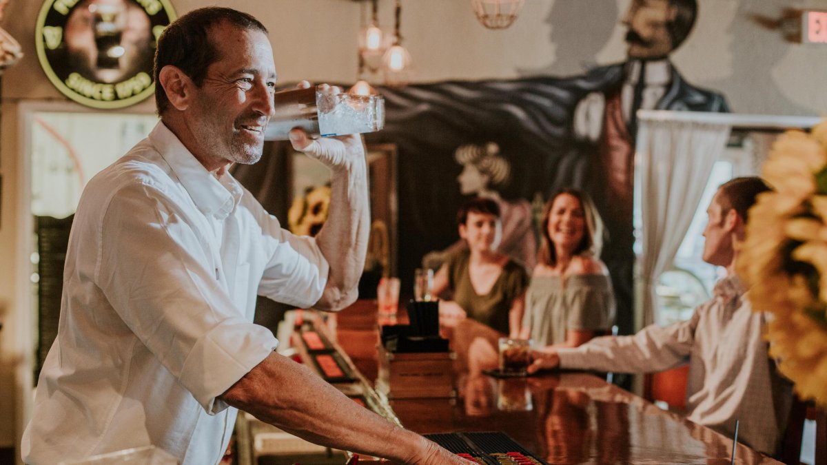 Bartender and people at a bar