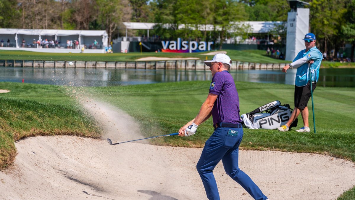 Golfer in sandtrap at the Valspar Golf Tournament