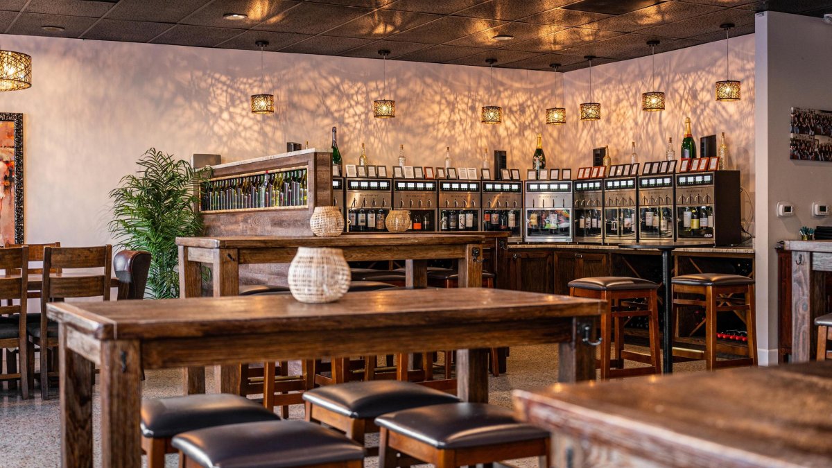 Sips Wine Bar interior with tables and wine dispensers 