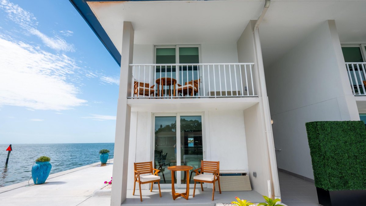 hotel patios and balconies with chairs next to Tampa Bay