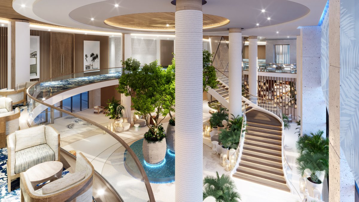 an elegant hotel lobby with a winding staircase