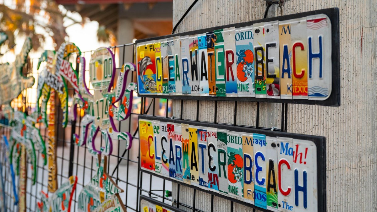 colorful artwork for sale that each say Clearwater Beach; the artwork is created from license plates