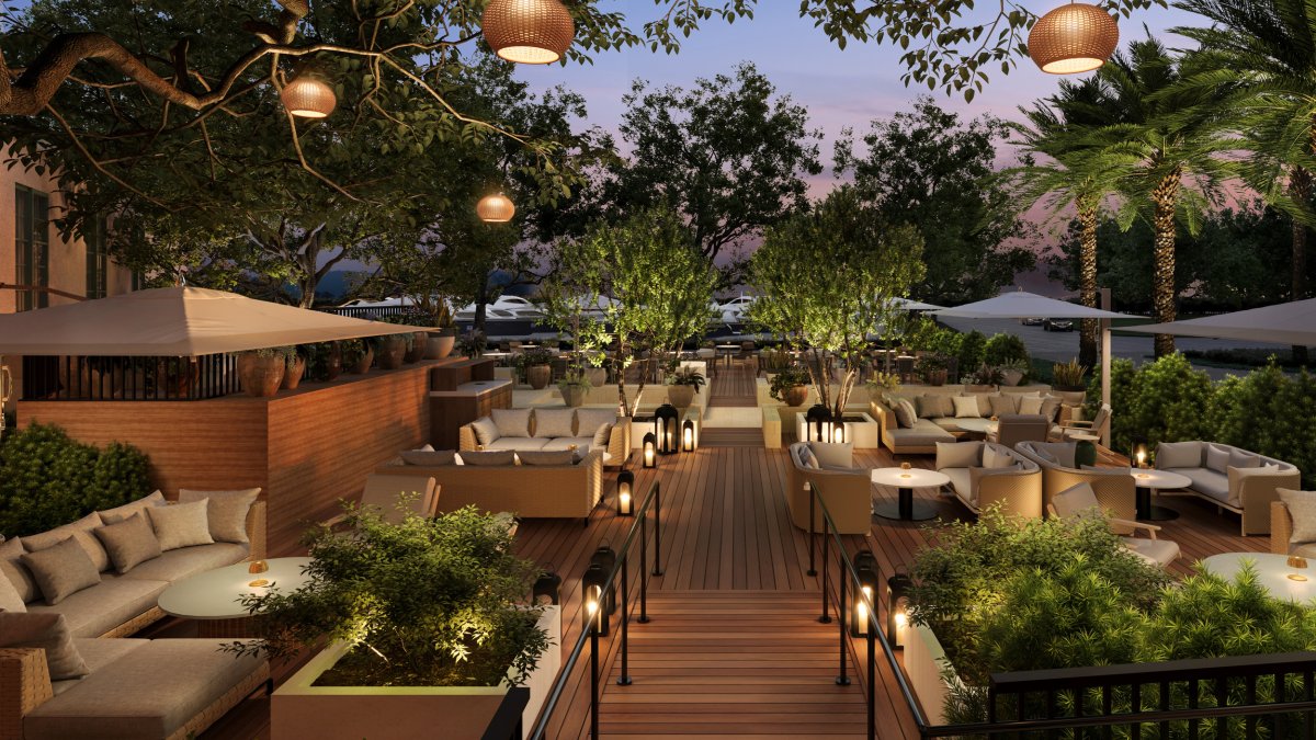 outdoor tables and benches on a wooden deck at the soon to open Elliott Aster restaurant at the Vinoy in St. Pete