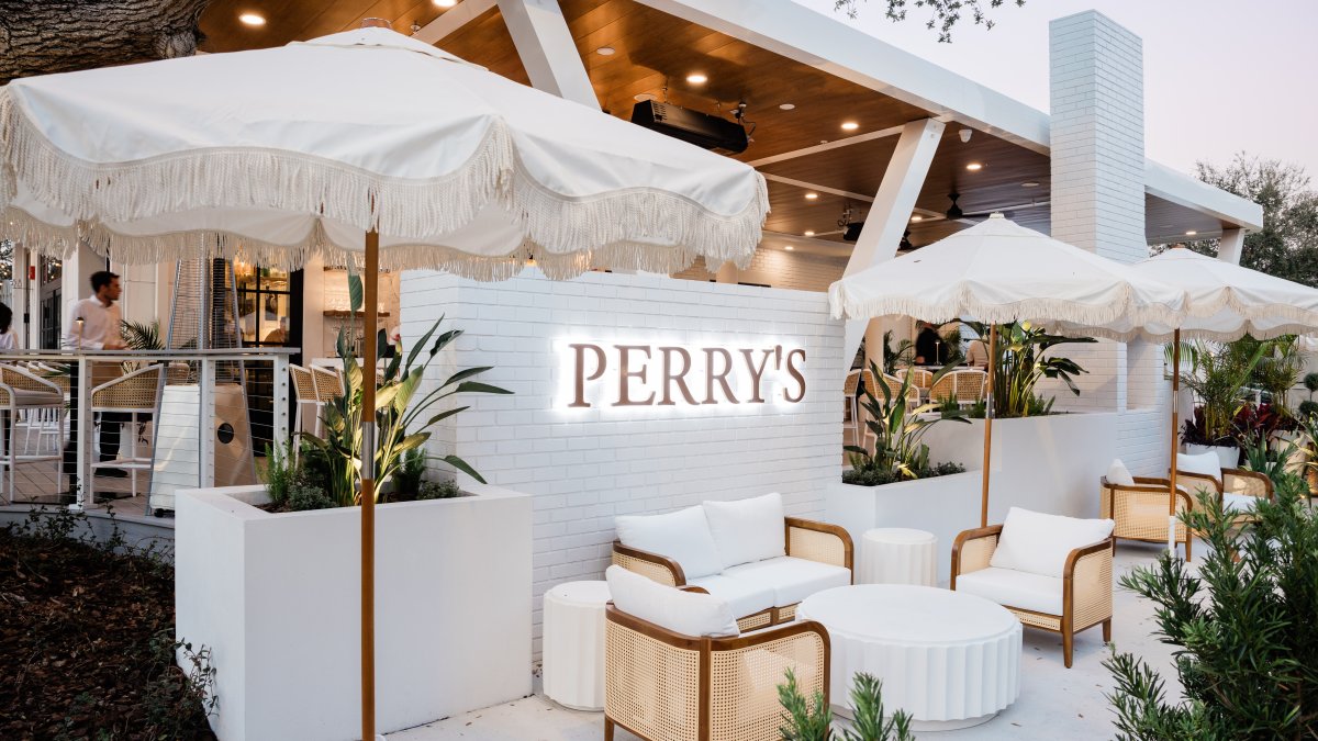 the exterior tables, chairs and umbrellas at Perry's Porch, a restaurant at the St. Pete Pier