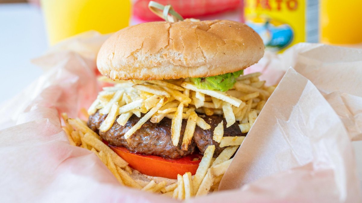 a frita burger topped with matchstick fries at Bodega in St. Pete