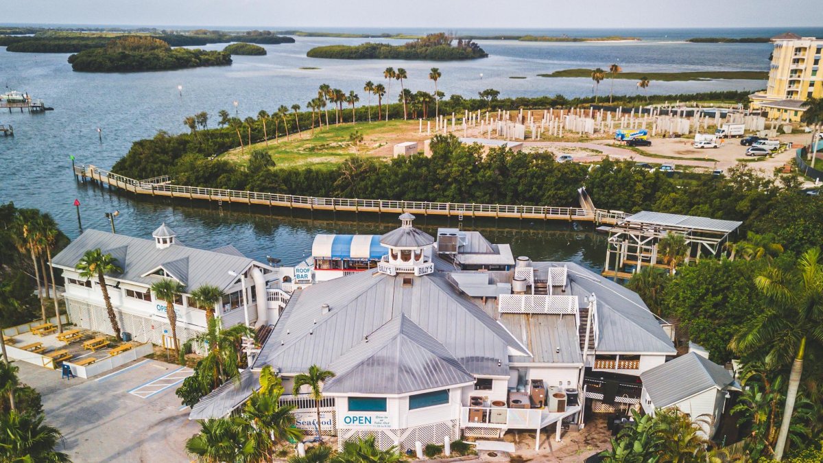an aerial view of the Key West-style Billy's Stone Crab with sparkling blue water and mangrove islands behind it