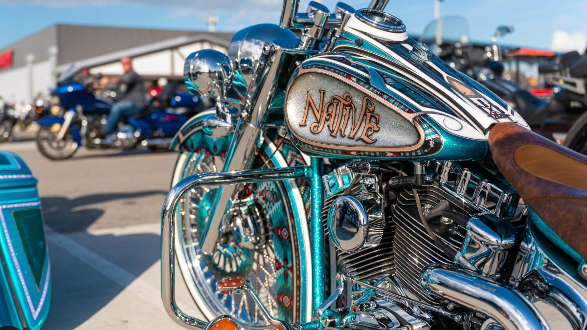 a close-up look at a green and blue motorcyle at St. Pete Bikefest