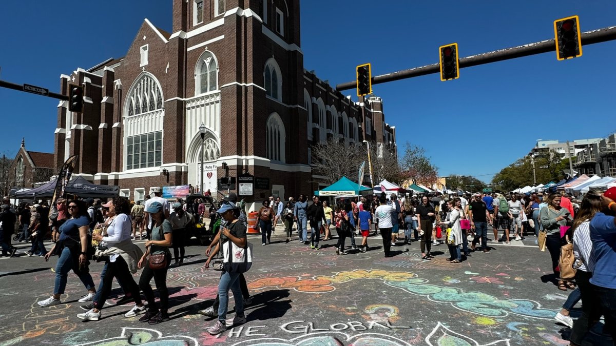 Global Love Project chalk art on the ground at Localtopia 2024 in St. Petersburg, FL