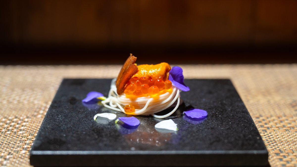 a beautiful plate of sashimi and fish eggs surrounded by flower petals at Sushi Sho Rexley in St. Petersburg FL