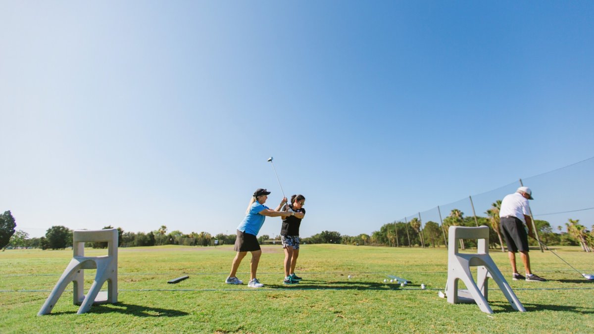 Charlaine Tatz, PGA Teaching Professional at Twin Brooks coaches a player on her swing