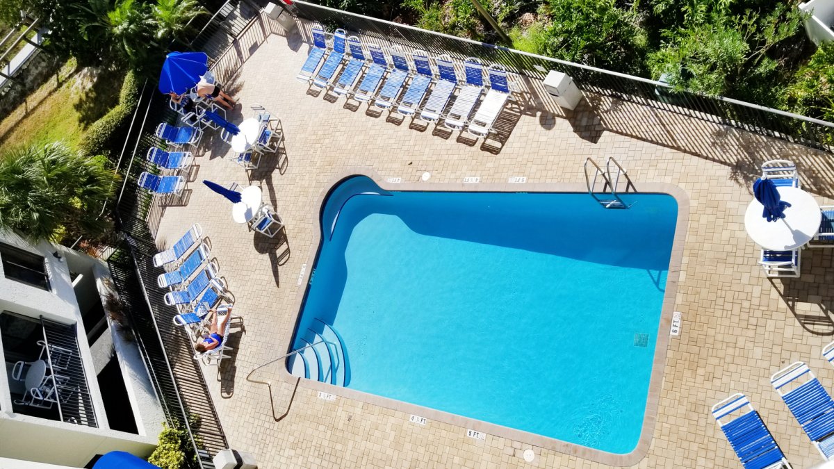 View of the pool from the balcony at the Caprice Resort by TRS