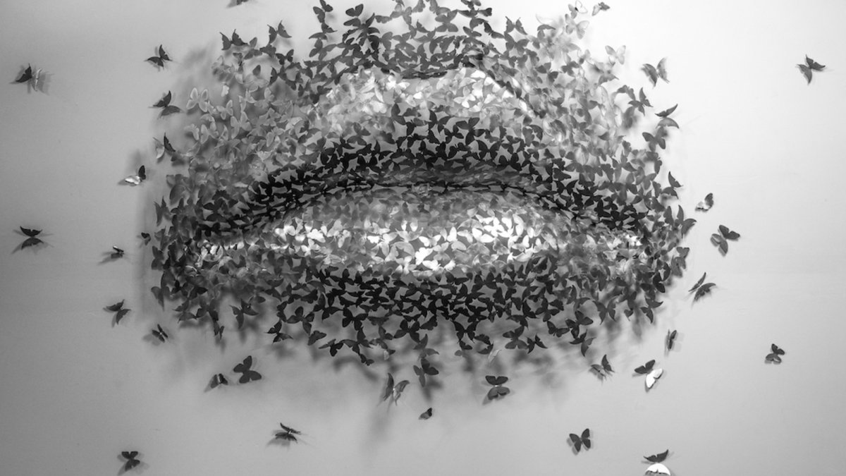 Butterfly Kiss, an oversized pair os stainless steel lips made of stainless steel butterflies