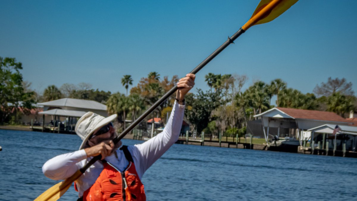 shoot for the Star! Kayaker pointing paddle