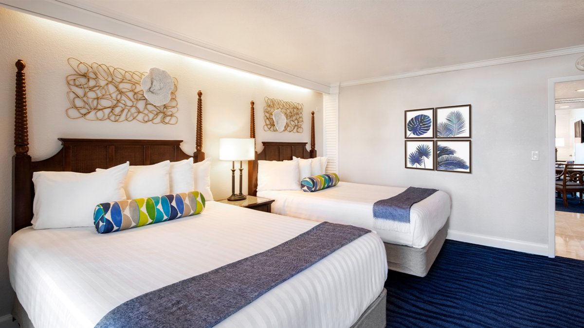 Suite with two queen beds and bright, airy modern furnishings.