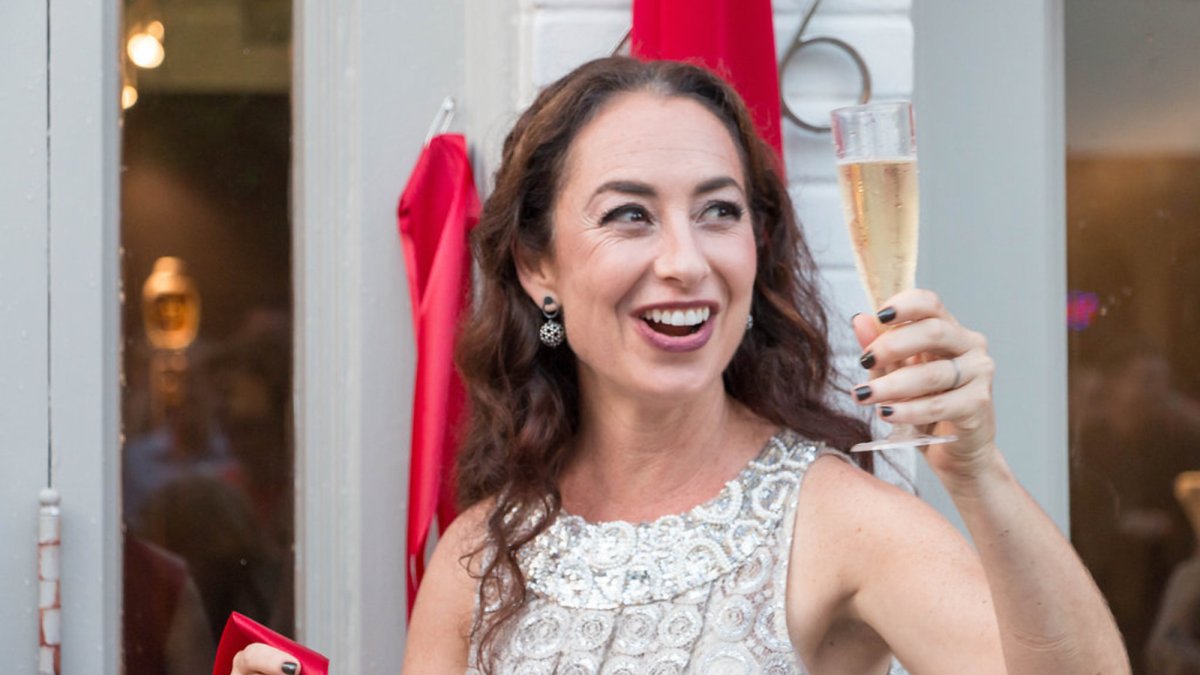 Marlene Rose gives a toast at the Grand Opening of the Marlene Rose Gallery