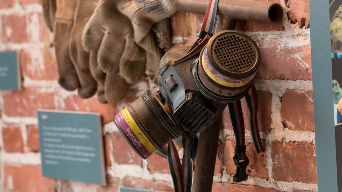 Protective mask and gloves artform of sandcast glass at the Marlene Rose Gallery