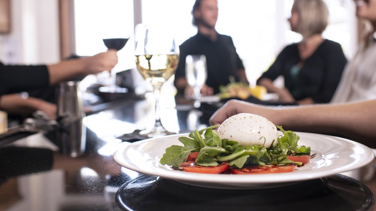 Enjoy a fresh Burratta Salad at the bar