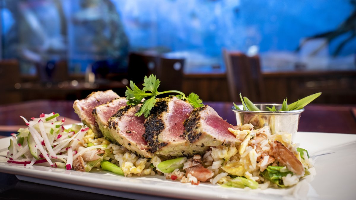 Wood Grilled Yellowfin Tuna with coconut, lemongrass, lime vinaigrette, crab fried rice