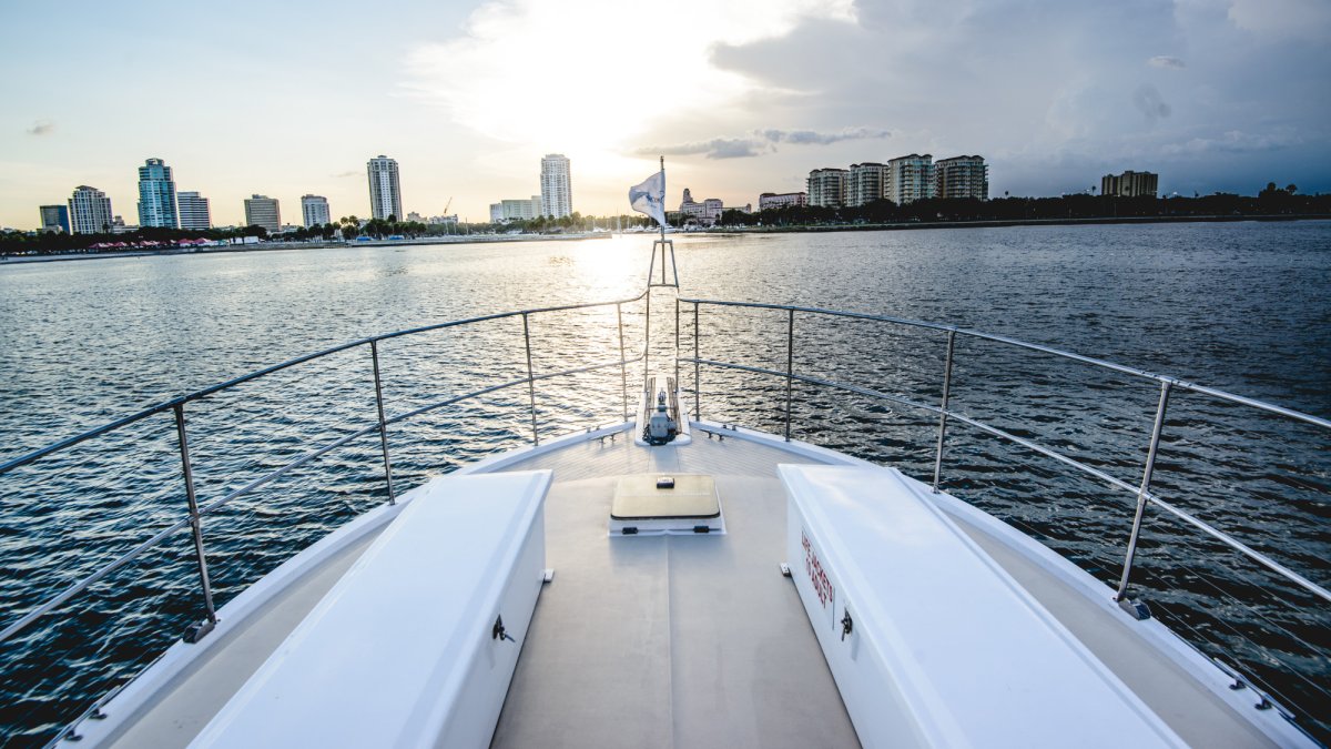 Enjoy the breeze in your hair and endless views while seating on the bow of this 43' luxury yacht