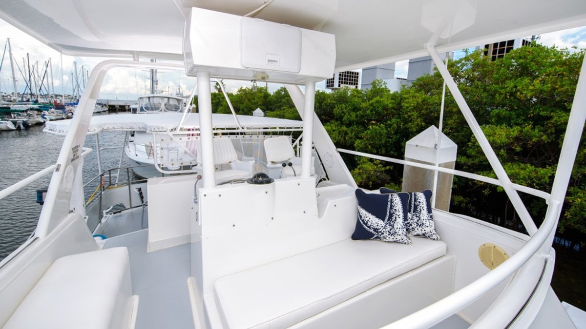 Relax on the covered captain's bridge and maybe even take a turn at the helm!