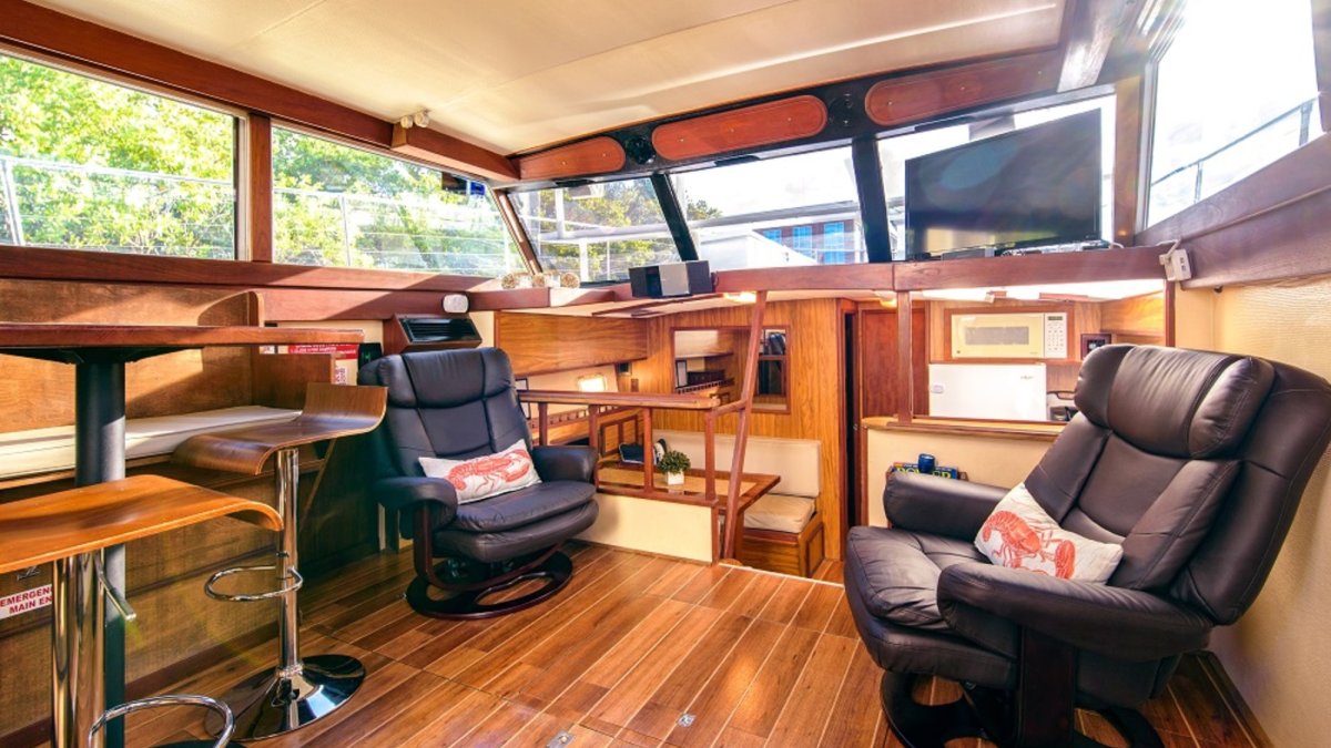 The Smooth C's has a spacious climate-controlled interior cabin with casual seating for 12