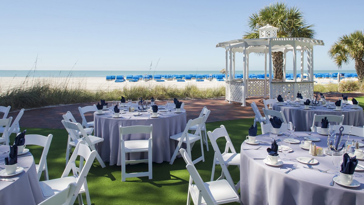 The 2,580 sq. ft. South Beach Lawn set up for a reception with round tables