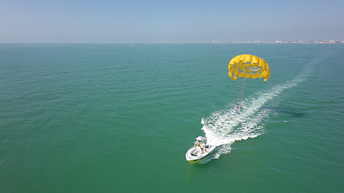 Aerial view of a pair of people parasailing