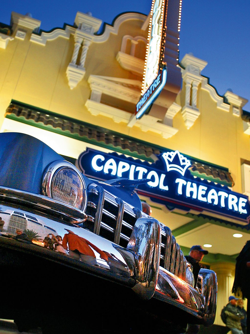 A close view of an antique car in front of Capitol Theatre in Clearwater