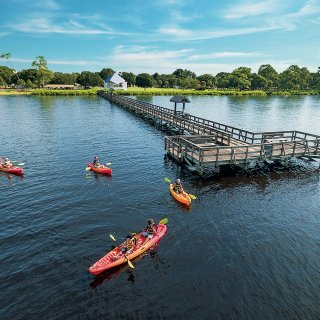 A group of people kayaking near Oldsmar pier at R.E. Olds Park.