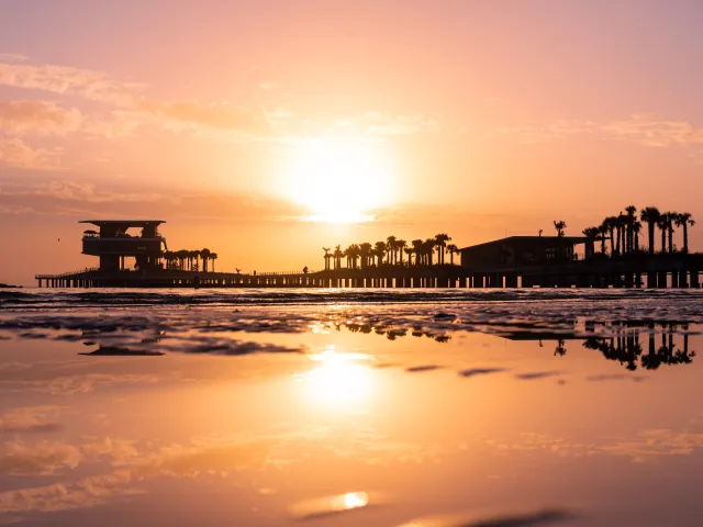 A pink and orange sunrise at St. Pete Pier