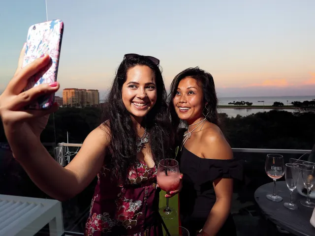 Two woman take a selfie at the Birchwood rooftop