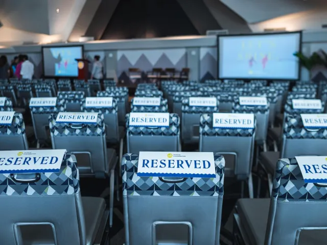 chairs with reserved signs on them