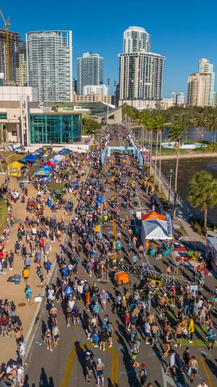 aerial view of many people running along Bayshore Drive for the St. Pete Run Fest