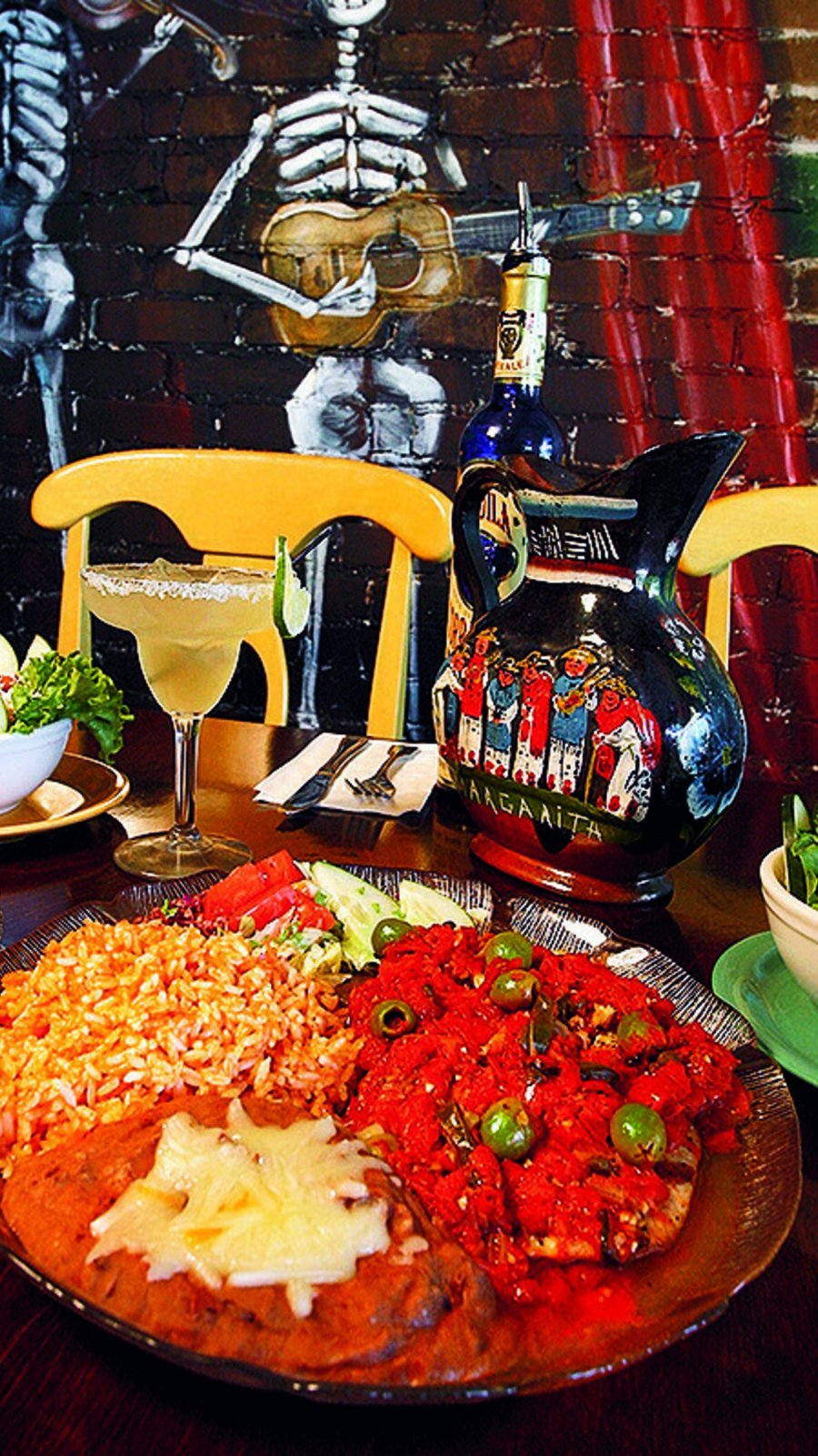 A dish of mexican food on a colorful table at Casa Tina Restaurant in Dunedin, Florida.