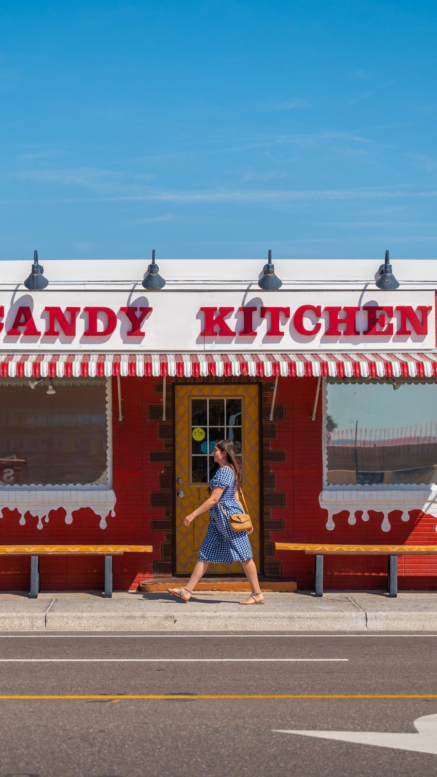 exterior red building with candy kitchen sign in madeira beach