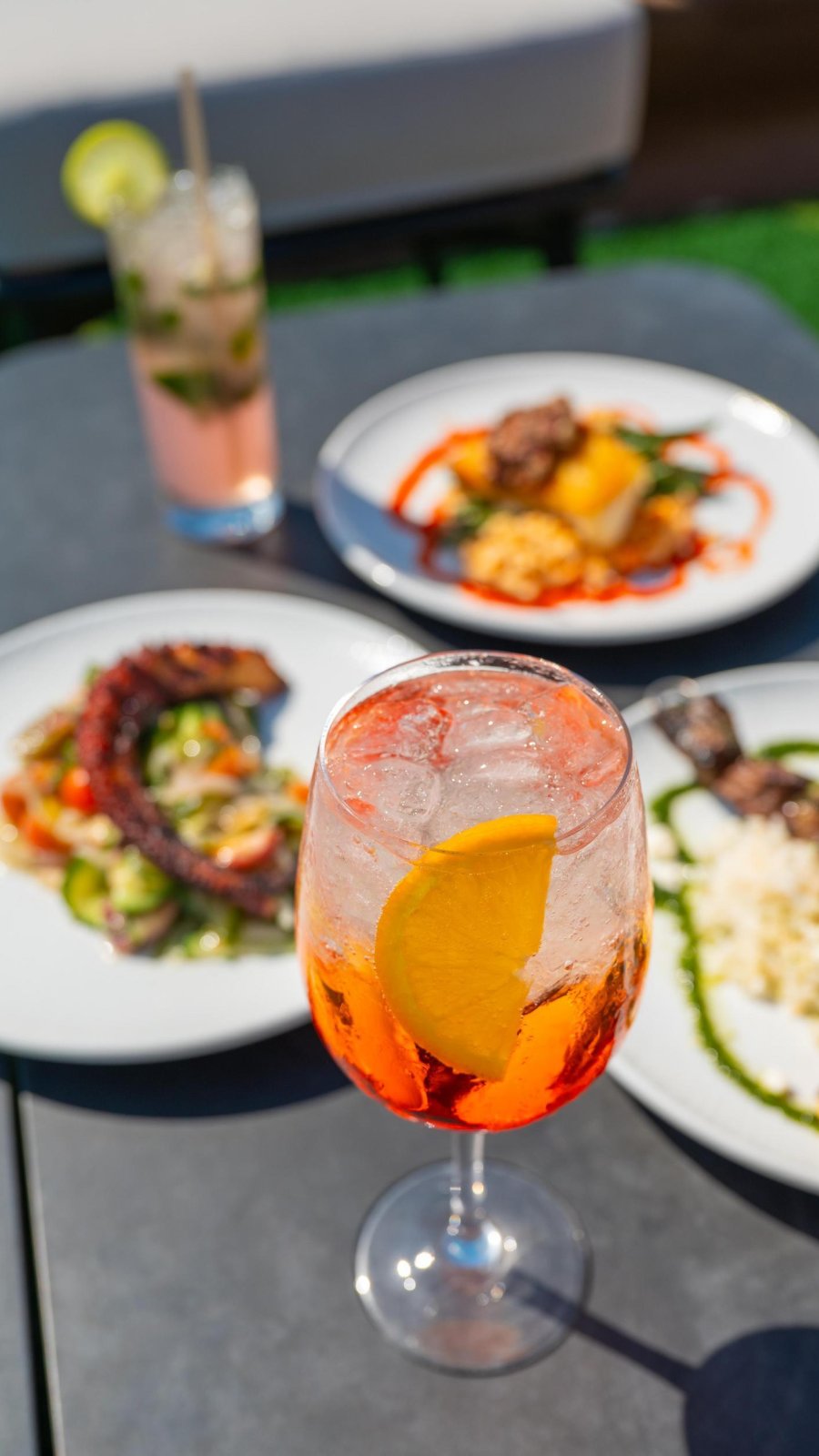 colorful cocktails and food on a table
