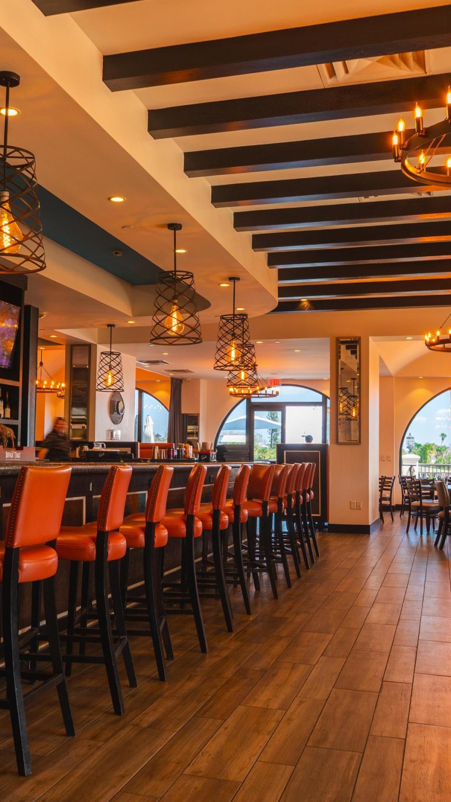 chairs lining bar and tables inside at hotel zamora restaurant