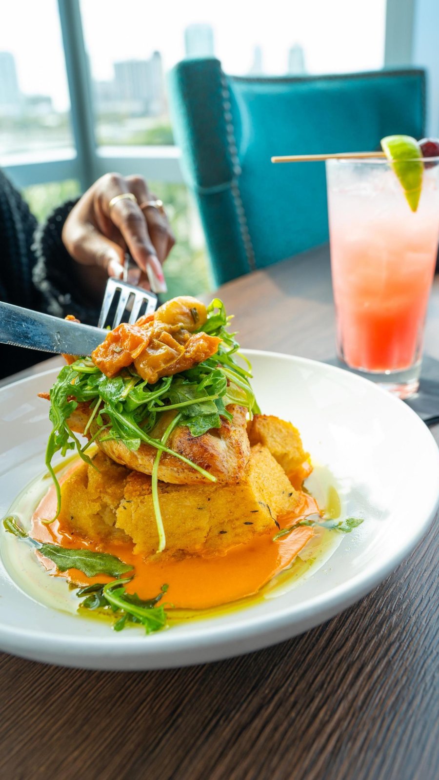 food piled high on plate at teak restaurant